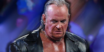 Undertaker Attacks AJ Styles at Elimination Chamber